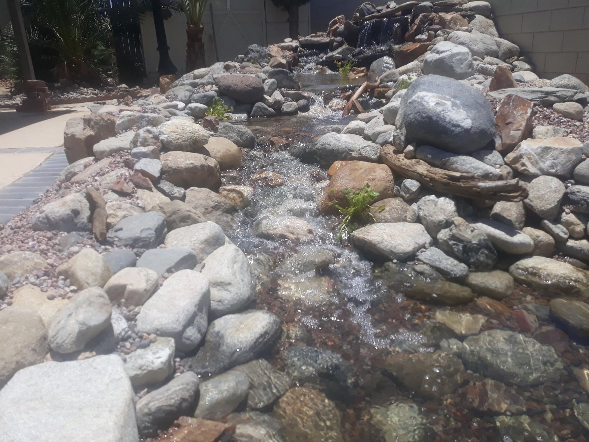 A stream of water flowing through a rocky area