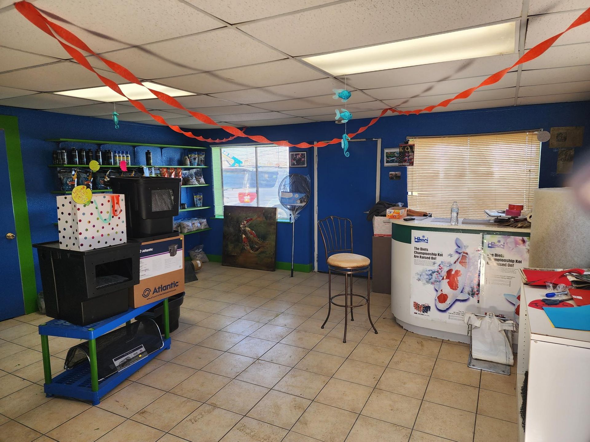 A room with boxes on a shelf and a counter