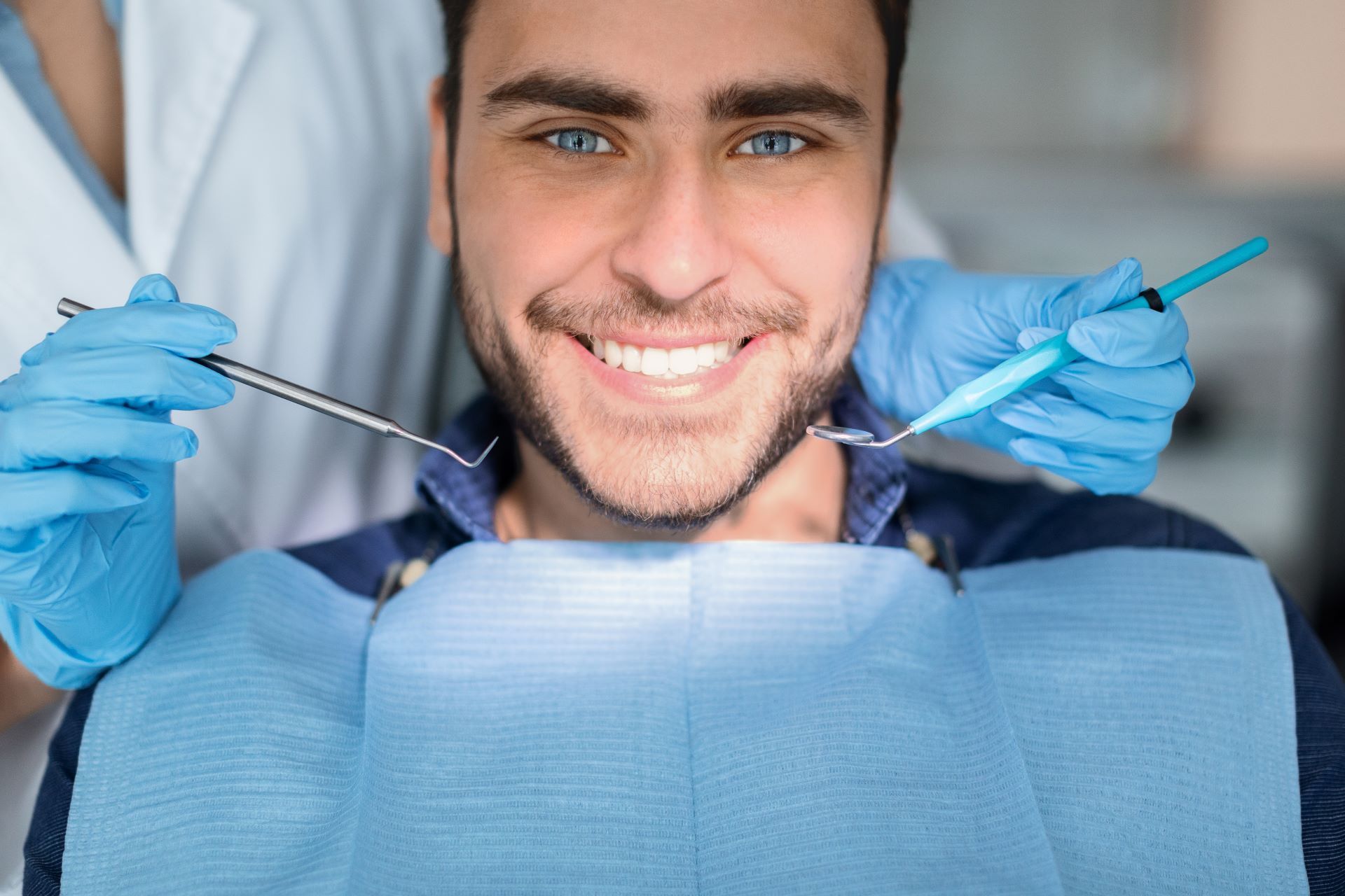 man smiling after teeth whitening