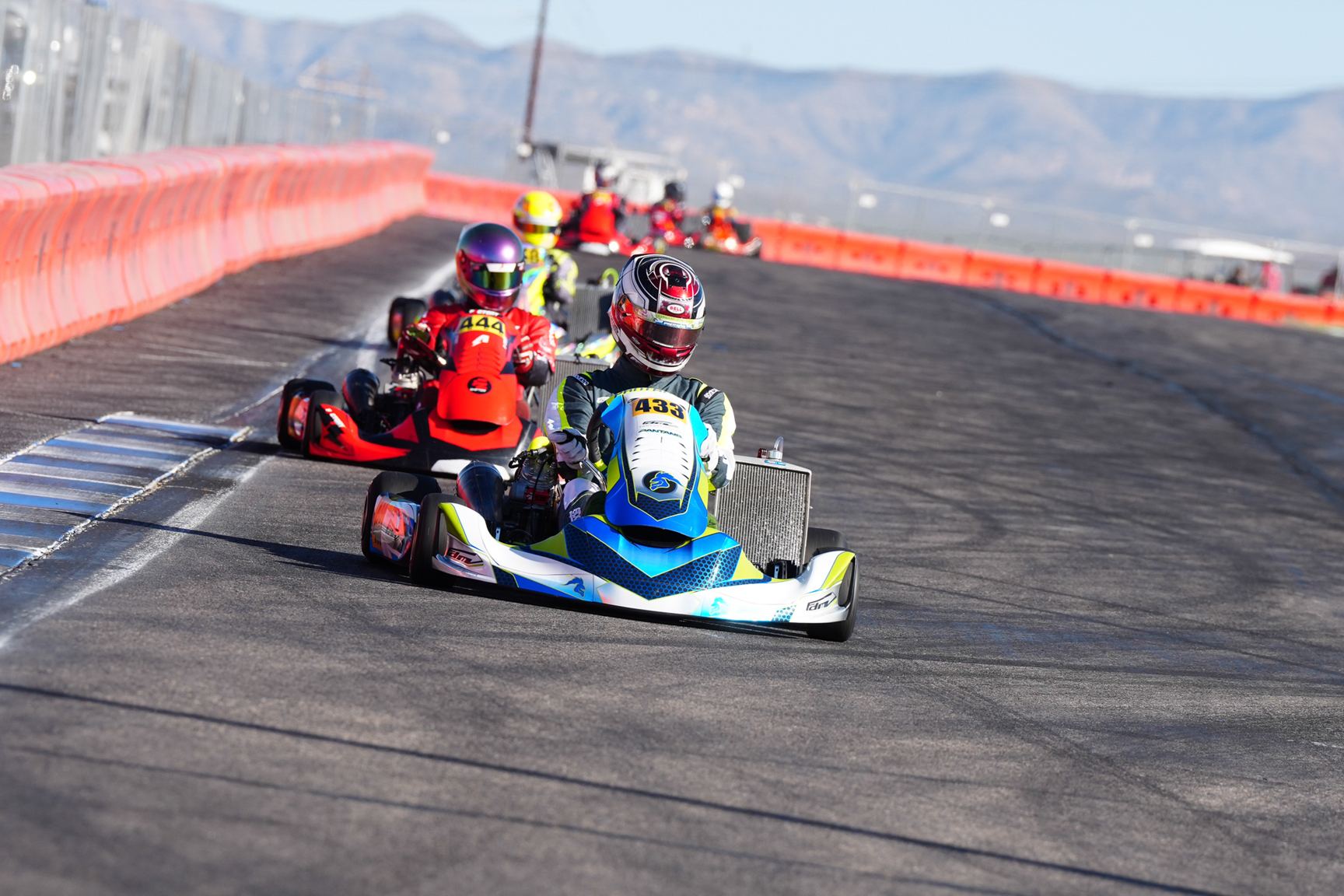 Advertisement: Save $1,000 on FZ Shifter engine. Trade in any 125cc kart engine. Red and black background. Engine visible.