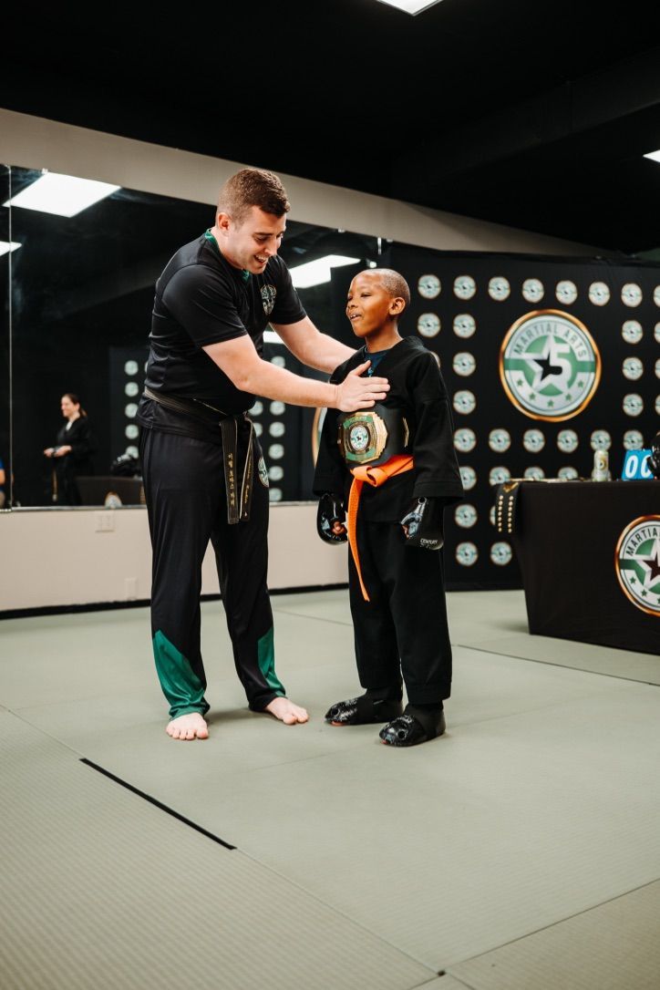 An aerial view of a city skyline at sunset.