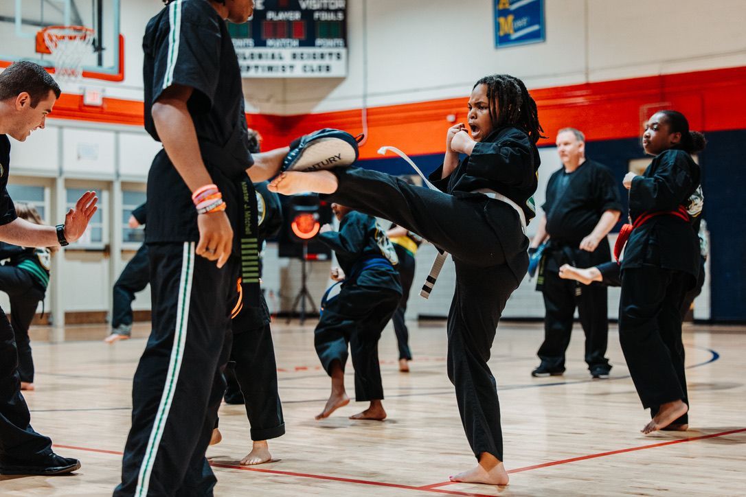 An aerial view of a city skyline at sunset.