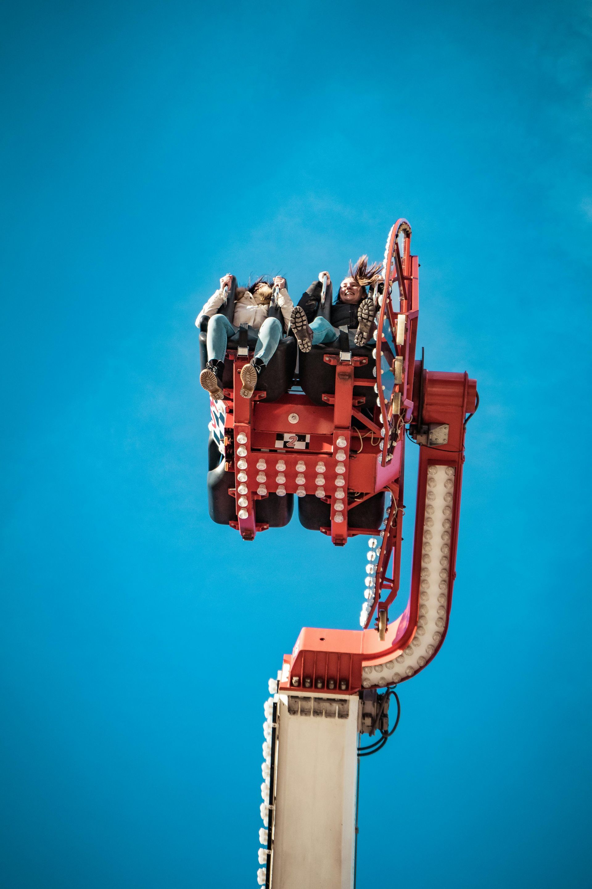 People in a boat on a water ride at Europa-Park; the boat splashes through a wave, creating a wall of water.