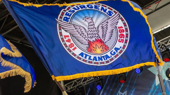 A blue flag with the word resurgents on it