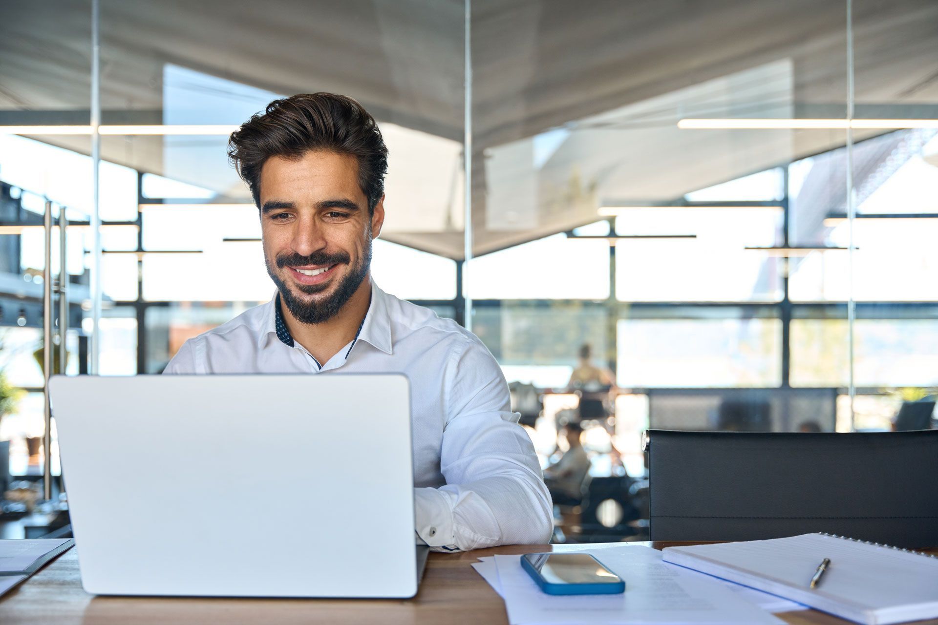 Man looking at a computer in an office