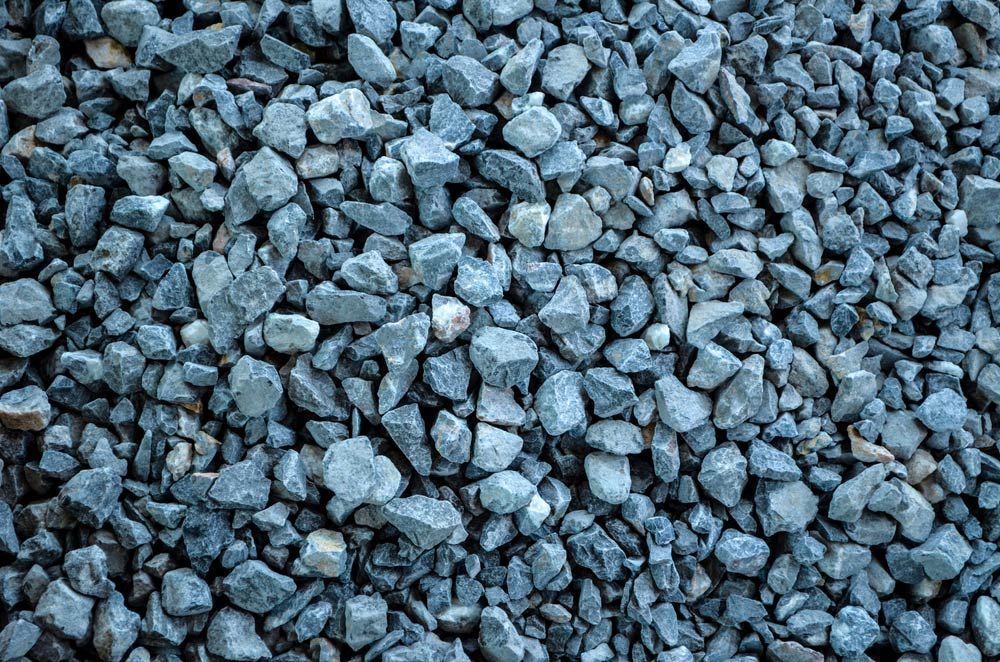A Pile Of Blue Gravel Is Sitting On The Ground — Mudgeeraba Landscape Centre In Mudgeeraba, QLD