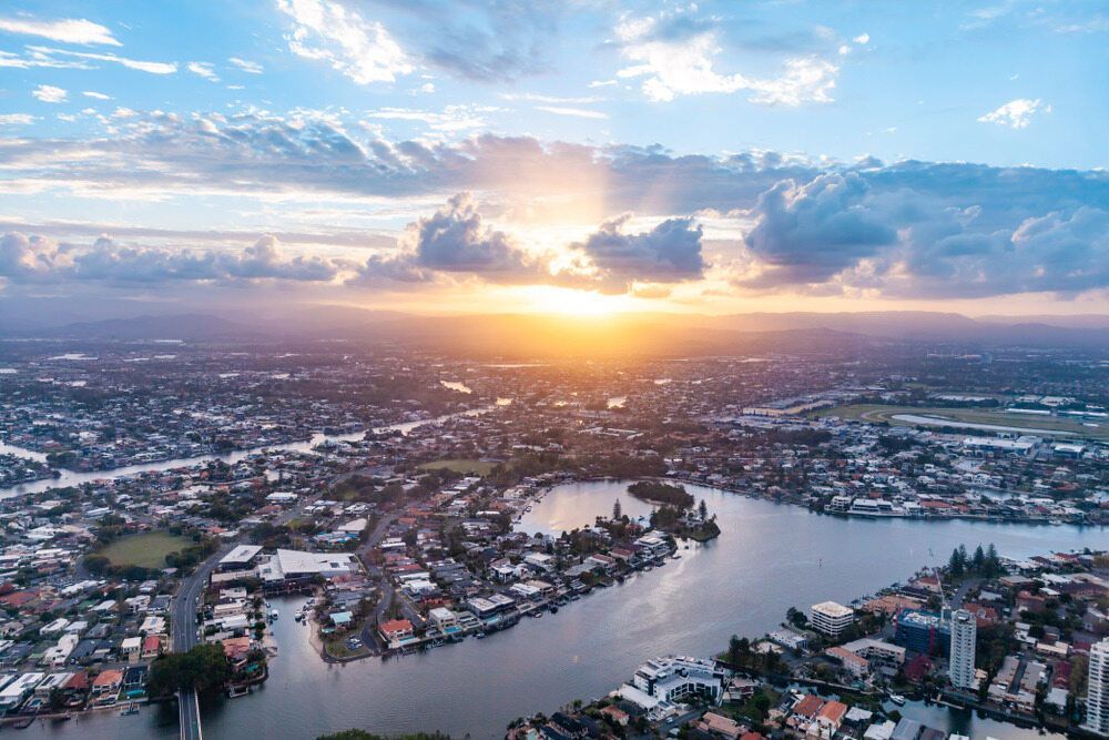 An Aerial View Of A City And A River At Sunset  — Mudgeeraba Landscape Centre In Nerang, QLD
