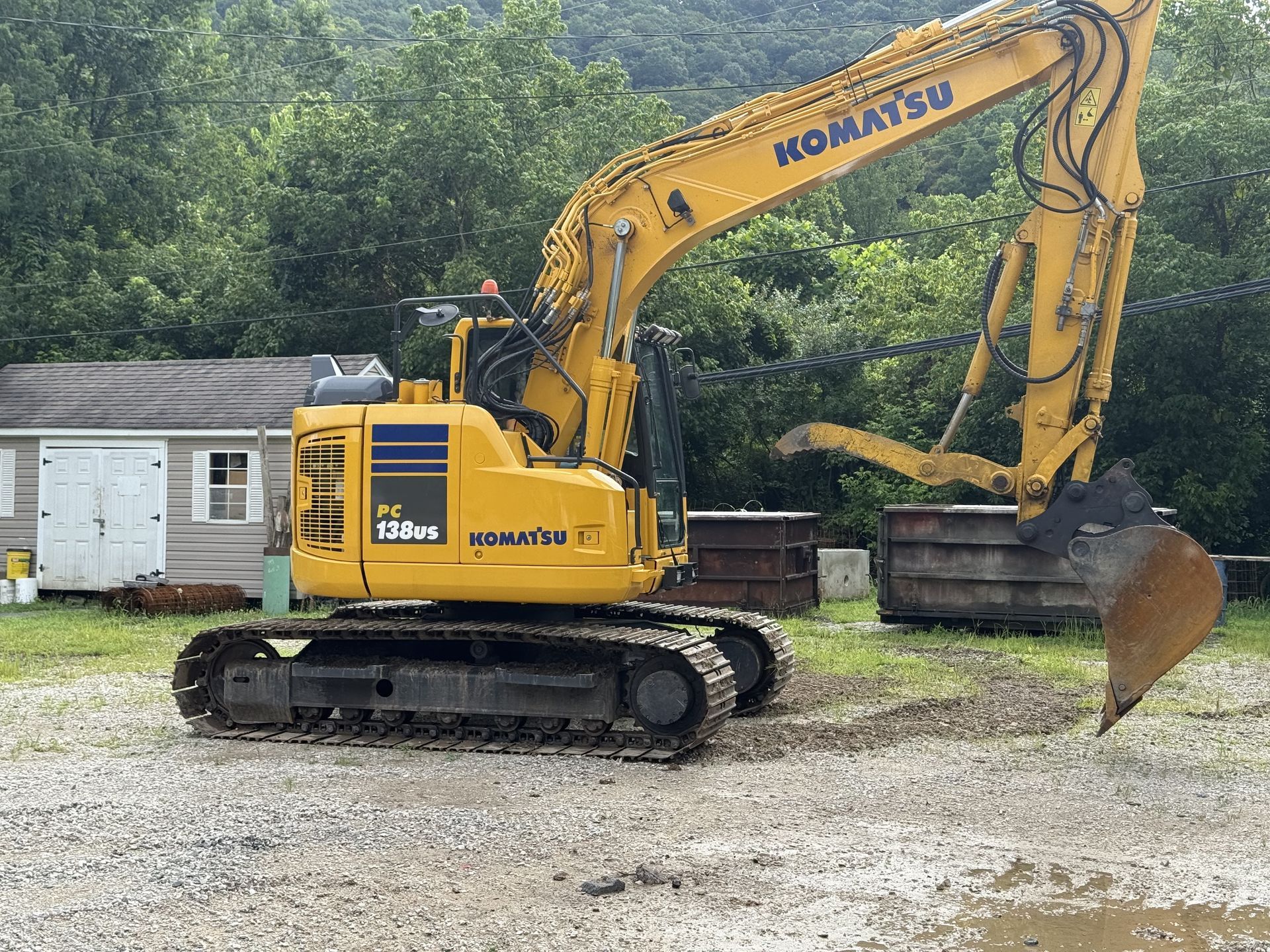 Two excavators are working on a construction site.