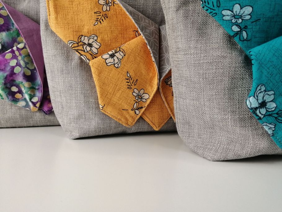 Handmade bags by Damson Moon Image of a variety of handmade origami butterfly handbags by Damson Moon