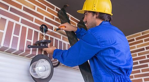 Lighting fixtures being installed by professional