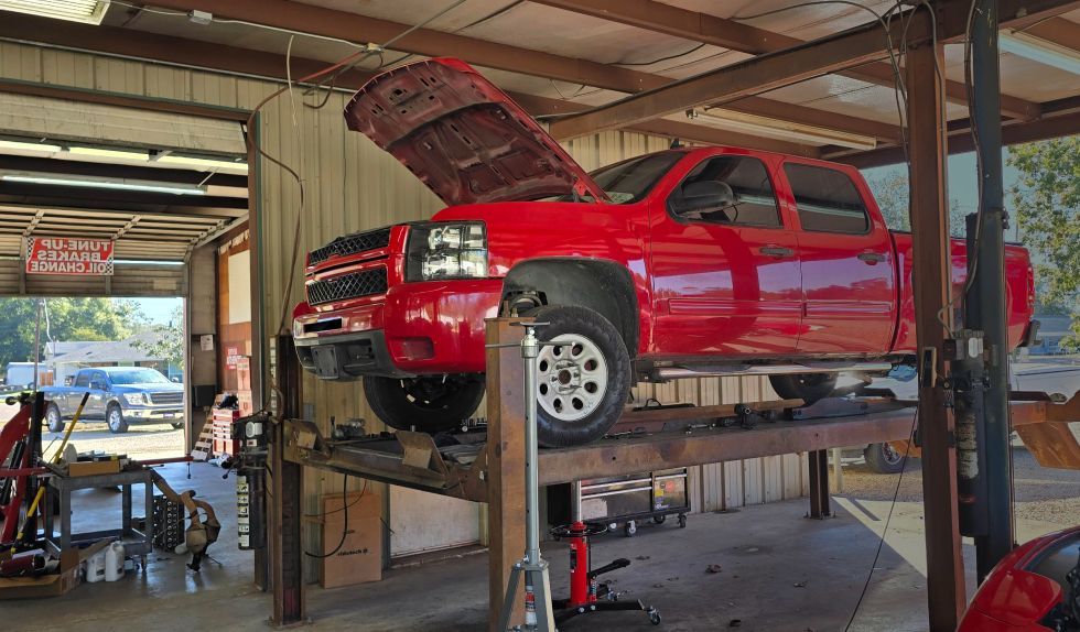 Red Truck on the Lift in Albany, LA -J&J Performance and Repair