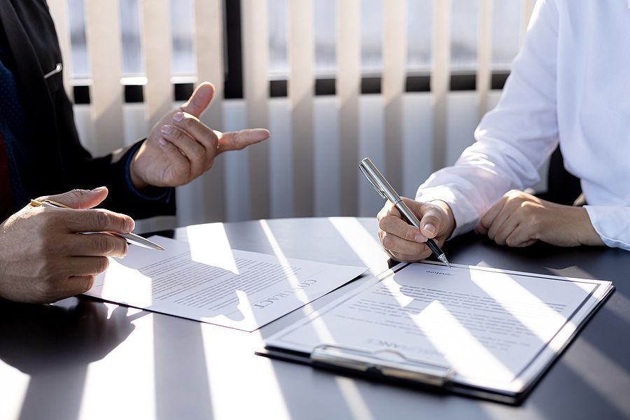 business people filling out paperwork