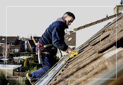Worker repairing roof - Slate roofing in Blain, PA