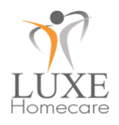 Logo of LUXE Homecare: gray and orange figure with outstretched arms above the text 