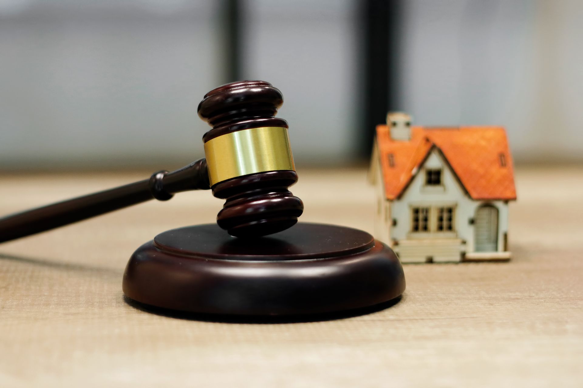 Family law concept. House model and Judge gavel on the table.