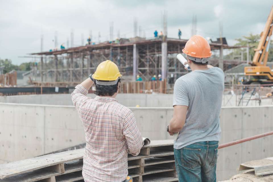 contractors checking the construction progress