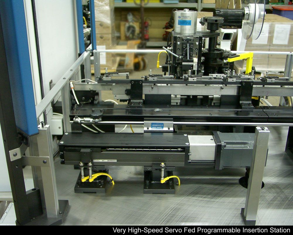 Very high speed servo fed programmable insertion machine