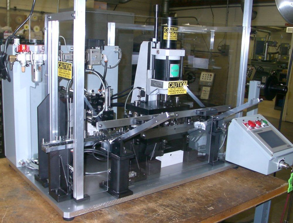 A machine that is being used to make tape and reel packing