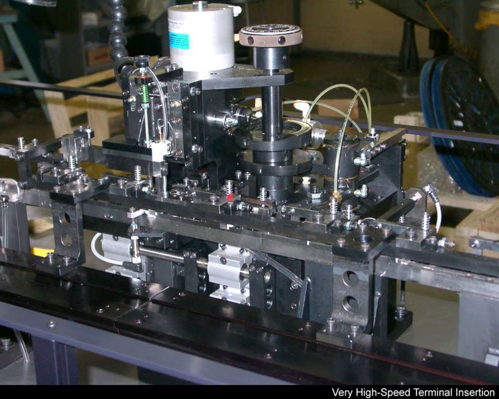 A very high speed terminal insertion machine in a factory