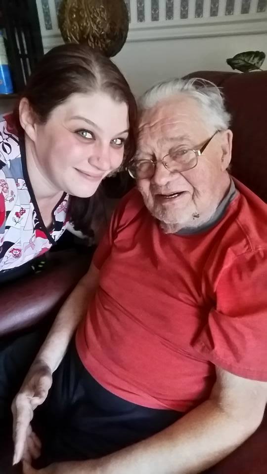 young nurse taking care of an old man