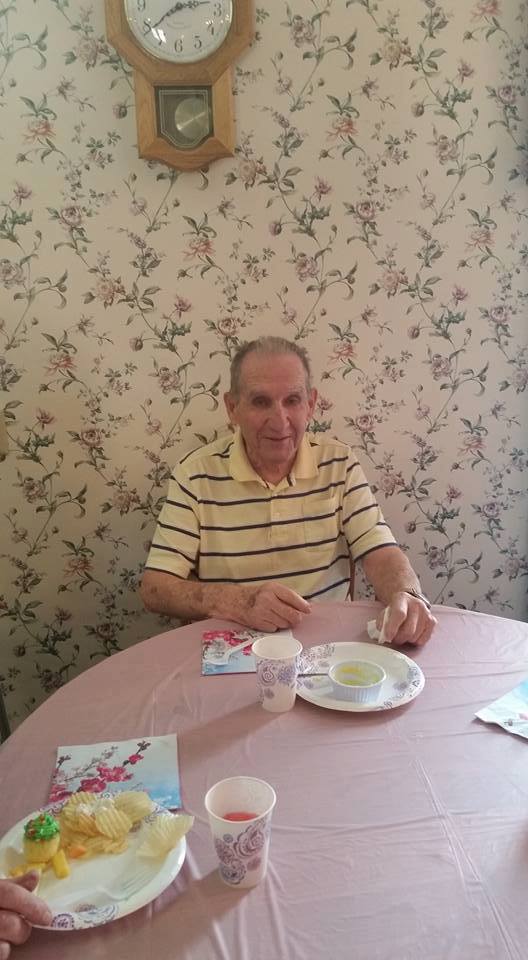 old man having breakfast