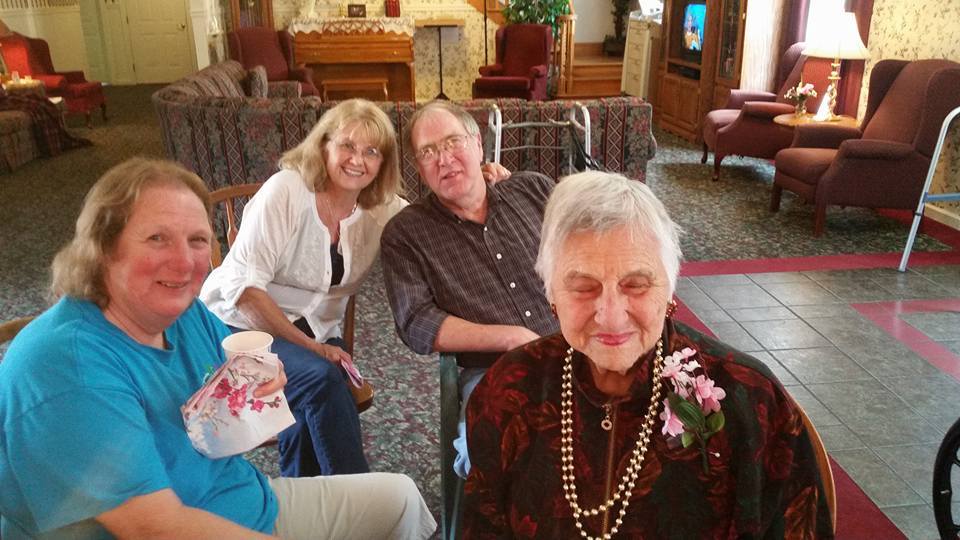 old women smiling at a nursing care center