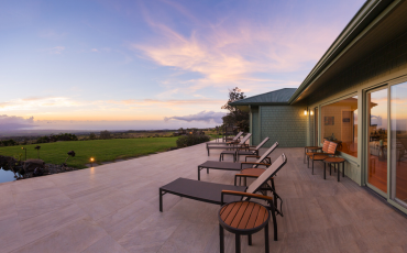 A photo of a deck that was custom-built by Pacific Peak Decks. The deck is built in the backyard of a home in their local town of San Bernardino, CA.