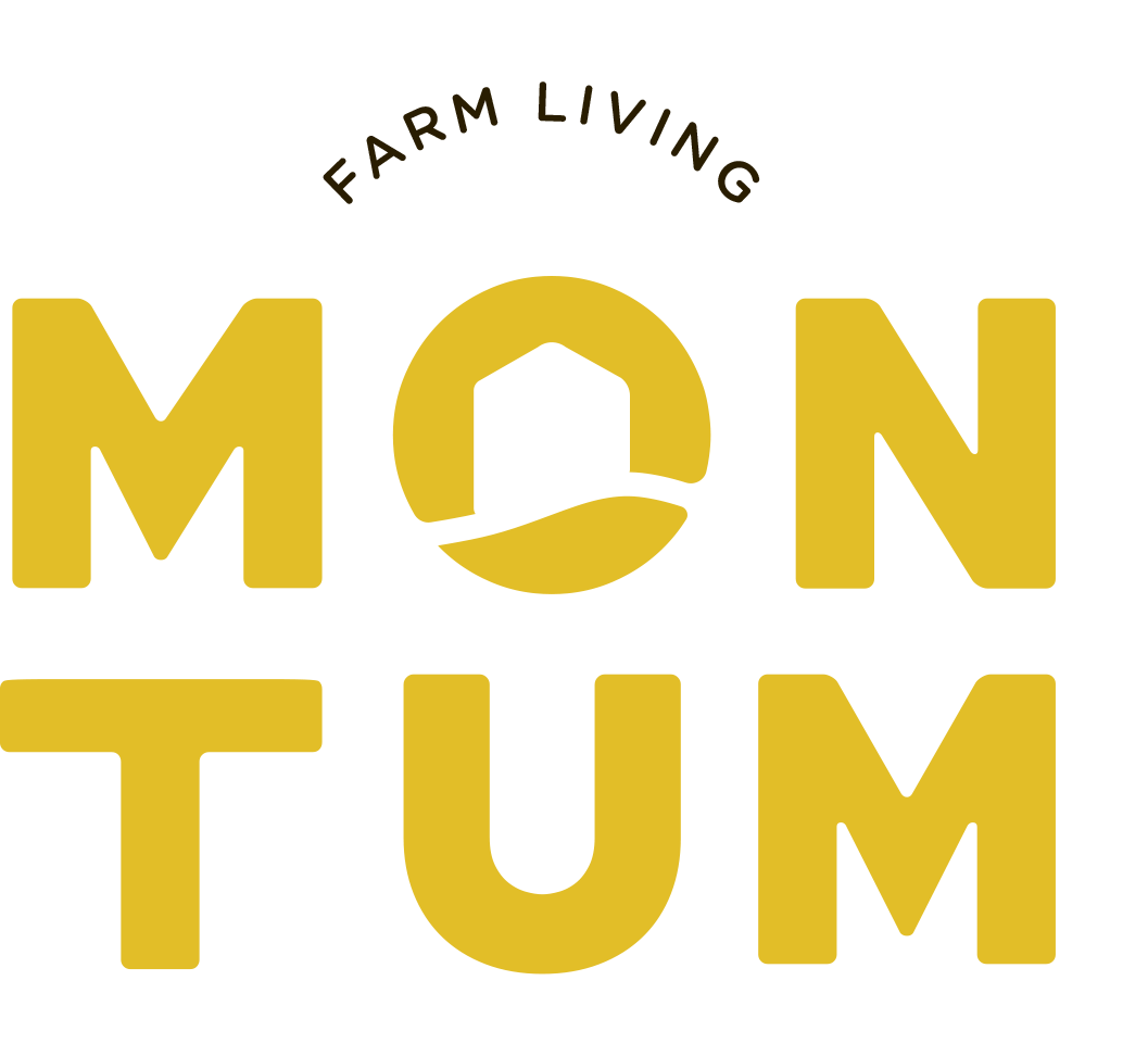 A yellow logo for farm living mon tum