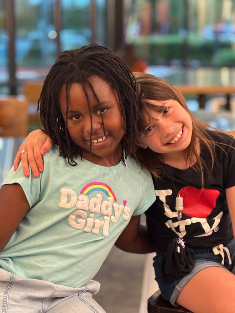 photo of two girls hugging