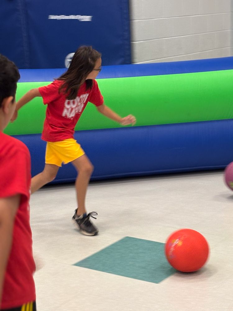 A girl in a red shirt that says county runner on it