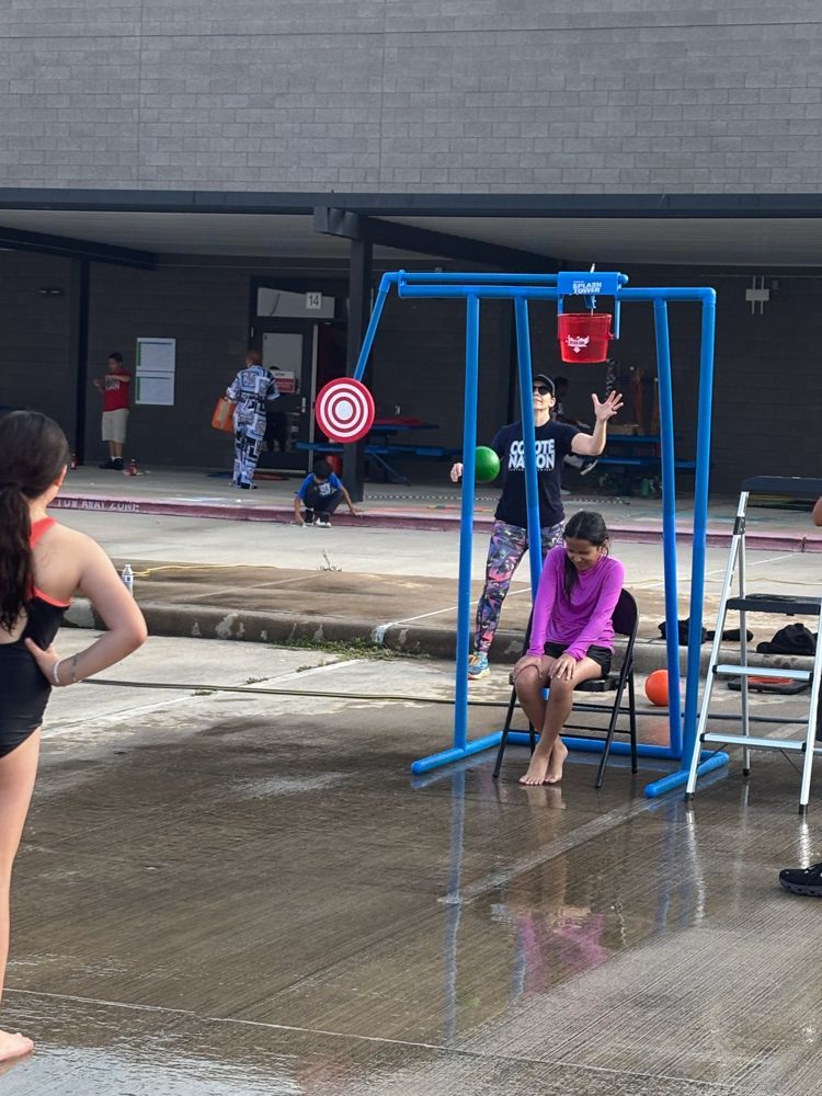 A group of children are playing in a water park.