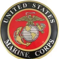 A united states marine corps emblem with an eagle , anchor , and globe.