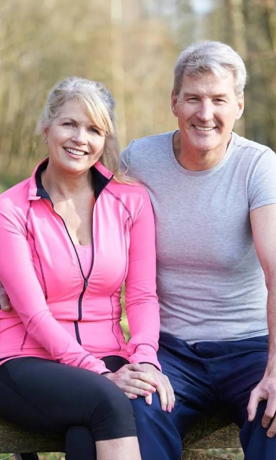 Mature Couple on Cycle Ride in Countryside