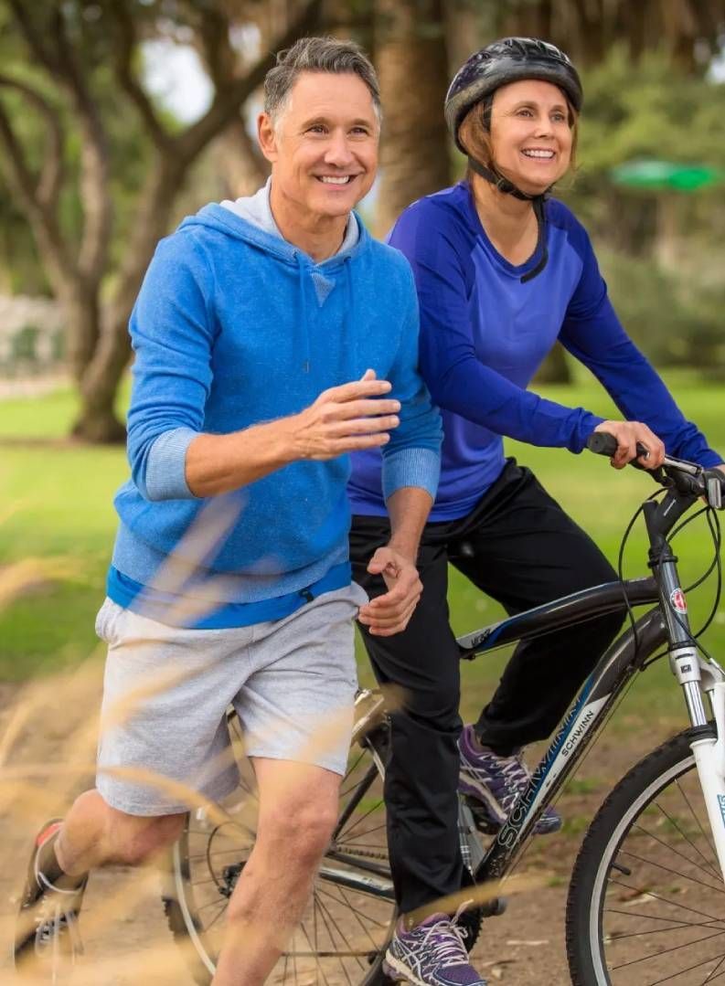 Man and Woman Cycling and Running