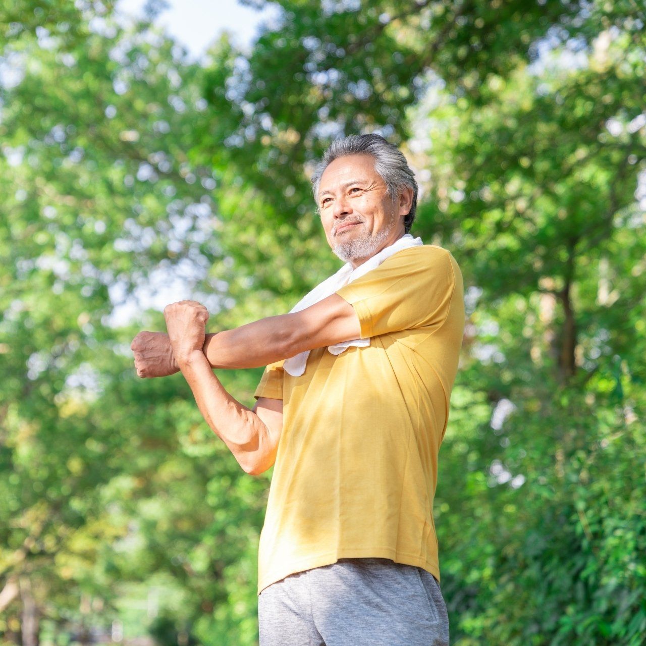 Elderly Man Exercising in The Park