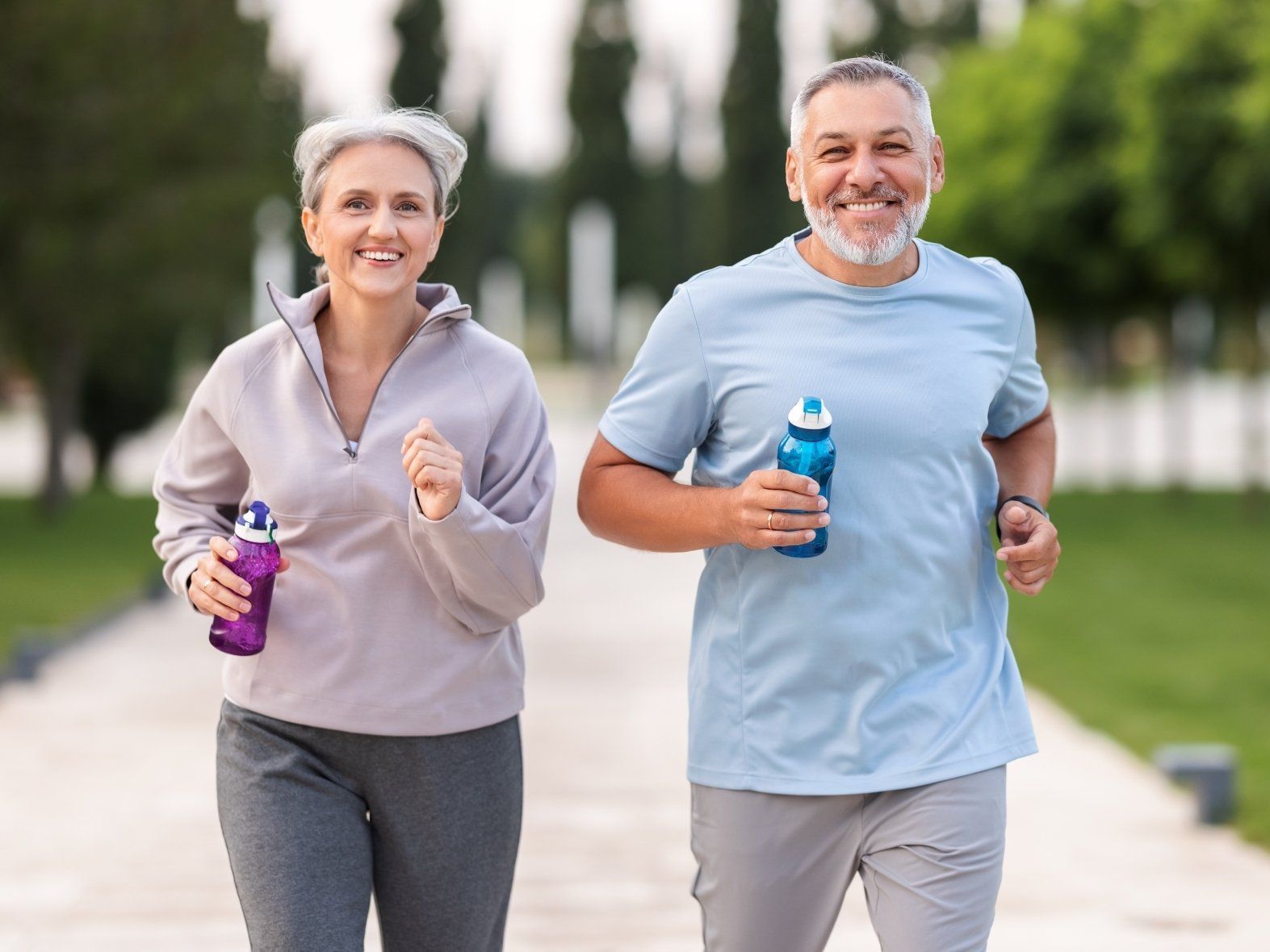 Couple Jogging Outside in City Park