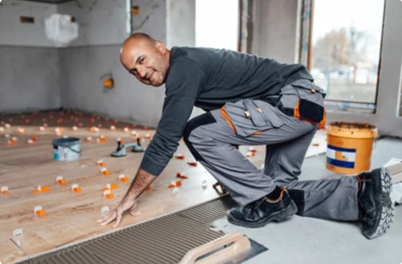 Smiling professional tiler providing expert service in Swansea.
