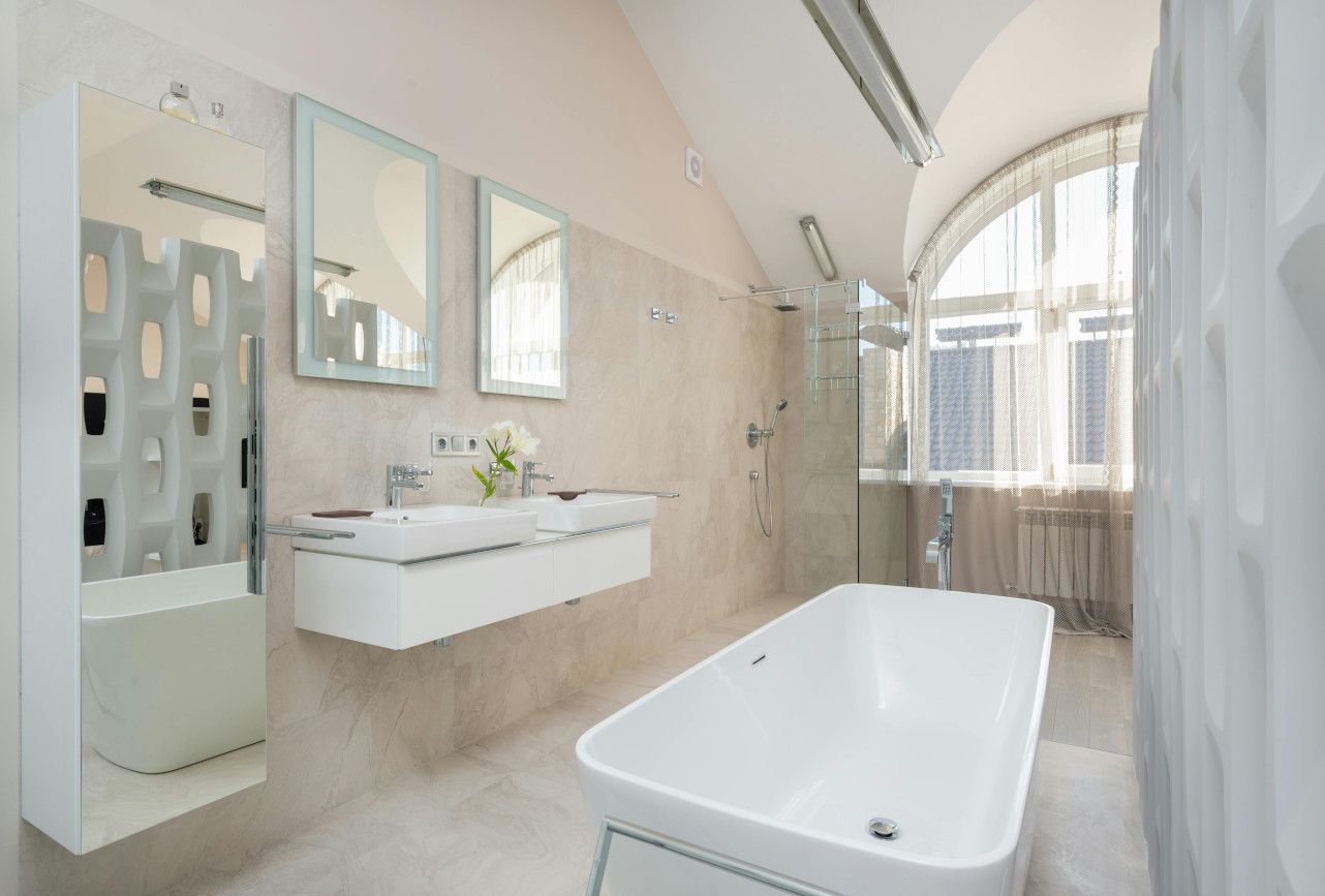 Bright and freshly tiled bathroom interior in Swansea.