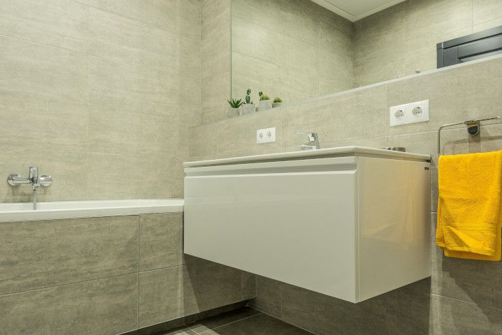 Modern bathroom featuring clean and professional tiling in Swansea.