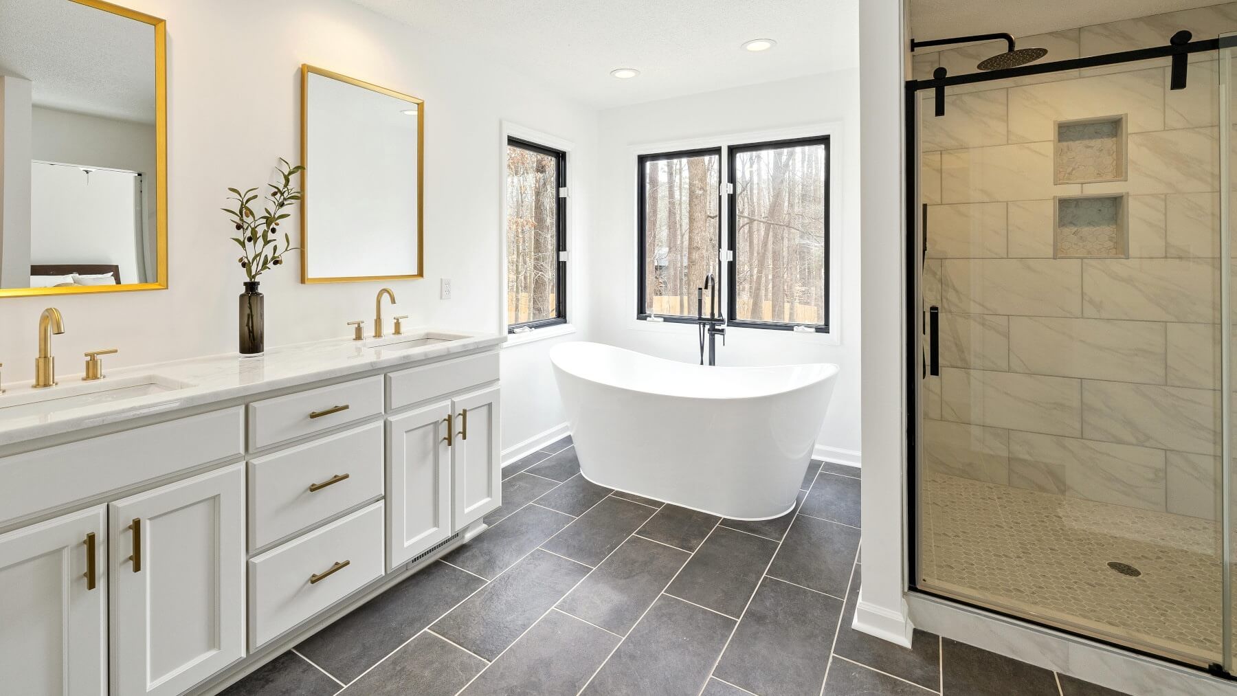 Large open plan Swansea bathroom - floor and shower wall tiled by Daffodil Tiling.