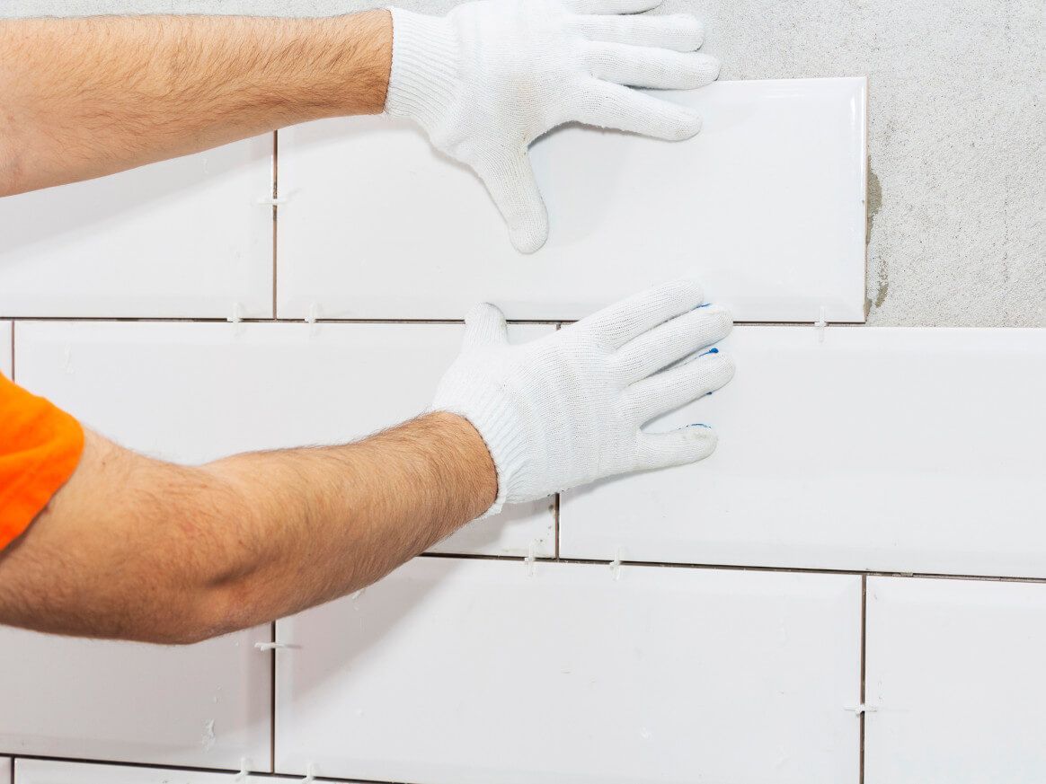 Bathroom wall tiling in progress on Swansea bathroom by Daffodil Tiling.