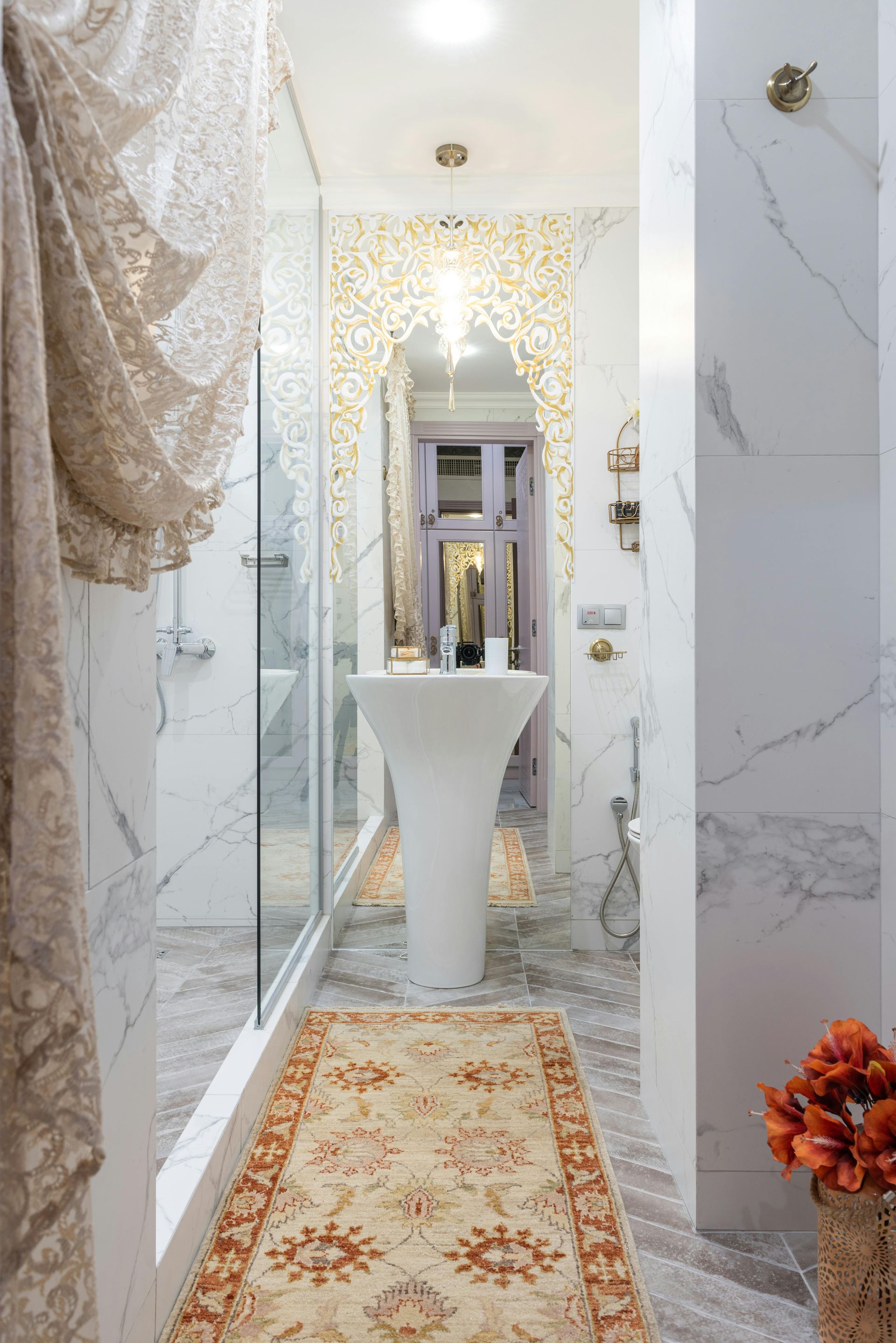 Lovely white marble Eastern style bathroom in Swansea by Daffodil Tiling