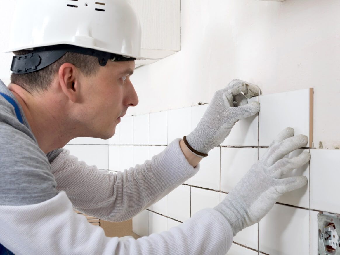 Swansea bathroom tiler completing a wall tiling project by Daffodil Tiling.
