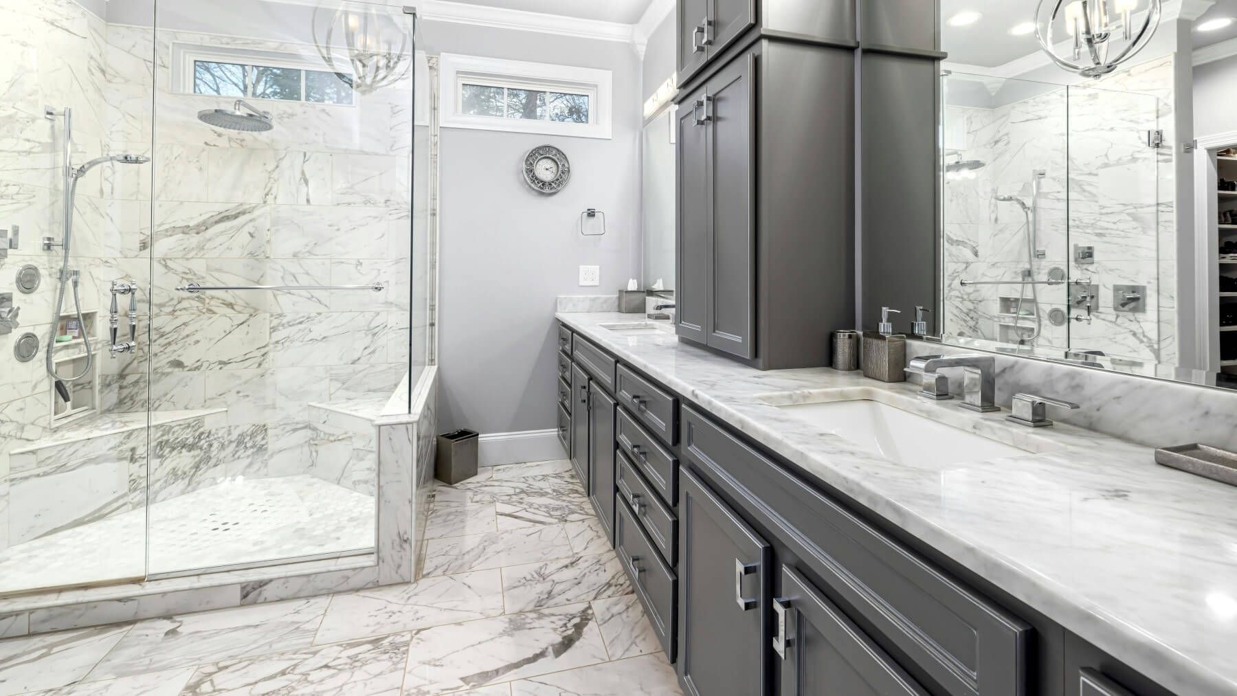 Swansea bathroom with luxury marble floor and shower and wall tiling by Daffodil Tiling.