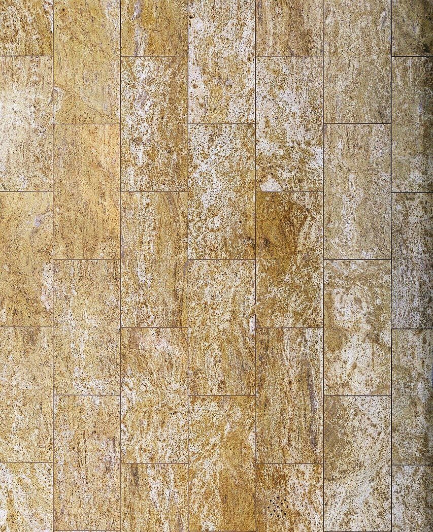 A close up of a tiled wall with a marble texture.