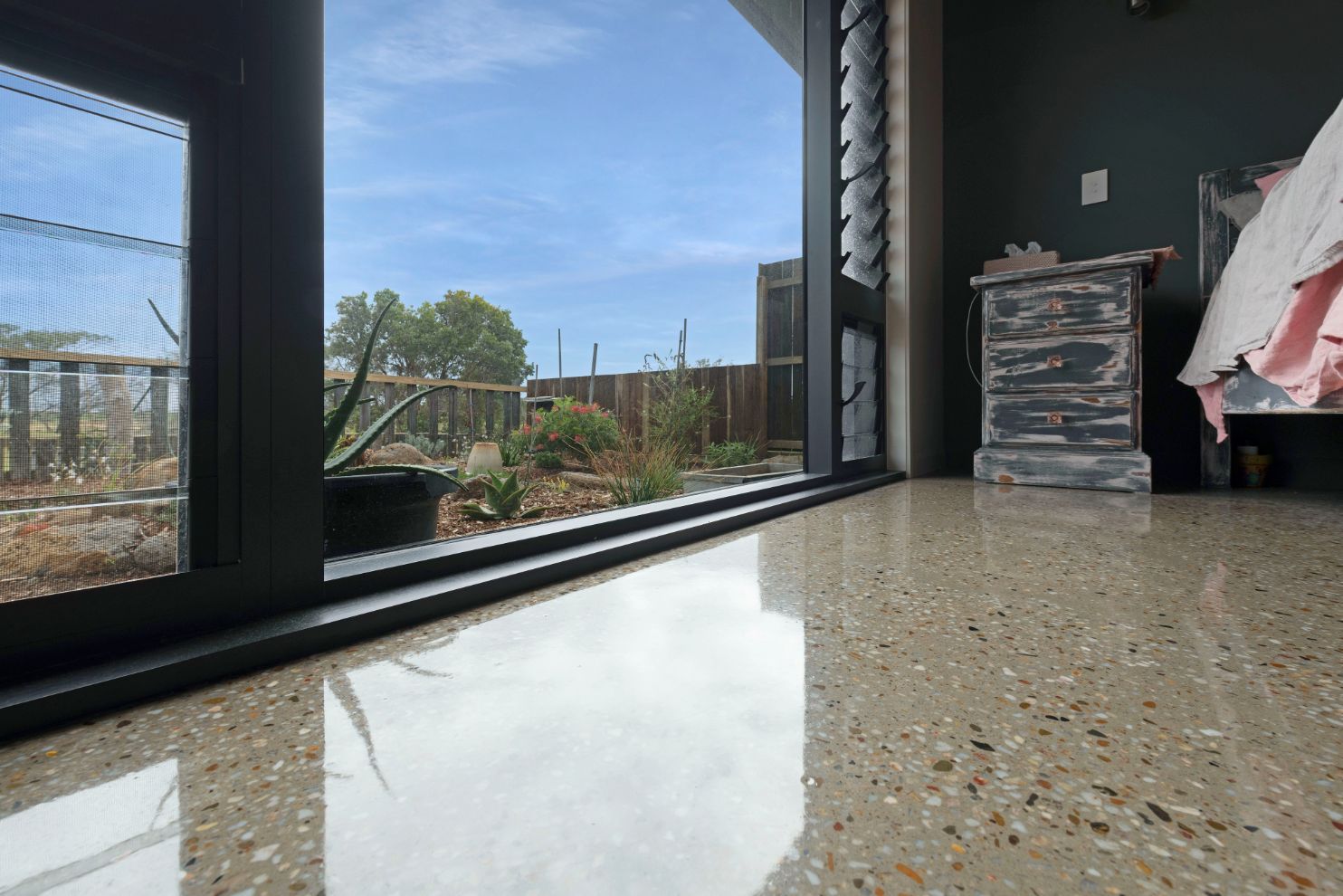 Polished Concrete Floor With Garden Outside — Concrete Grind & Seal in Bundaberg South, QLD