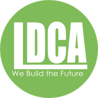 A circular lime green logo with white text reading 