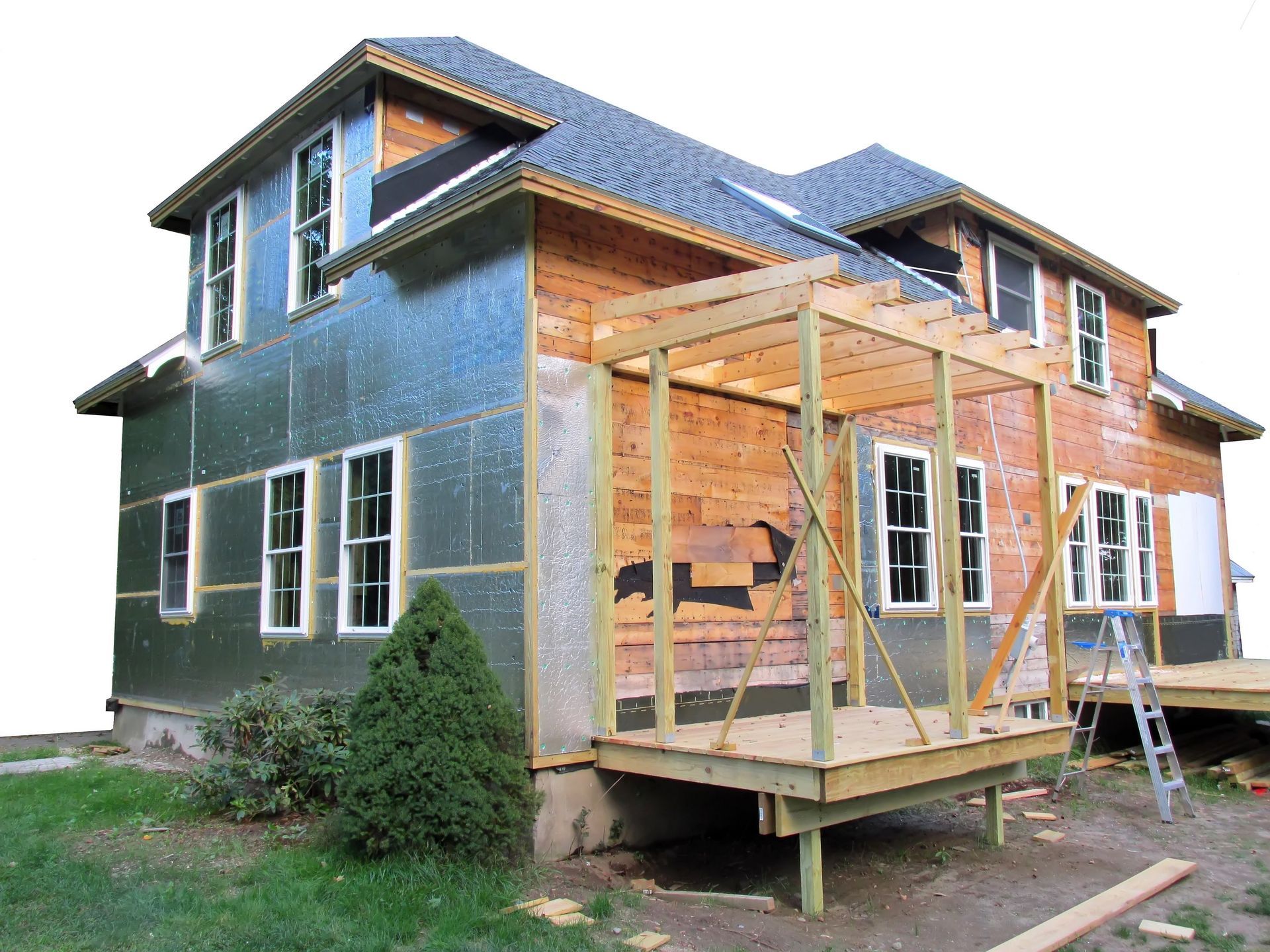 A house that is being built with a ladder in front of it