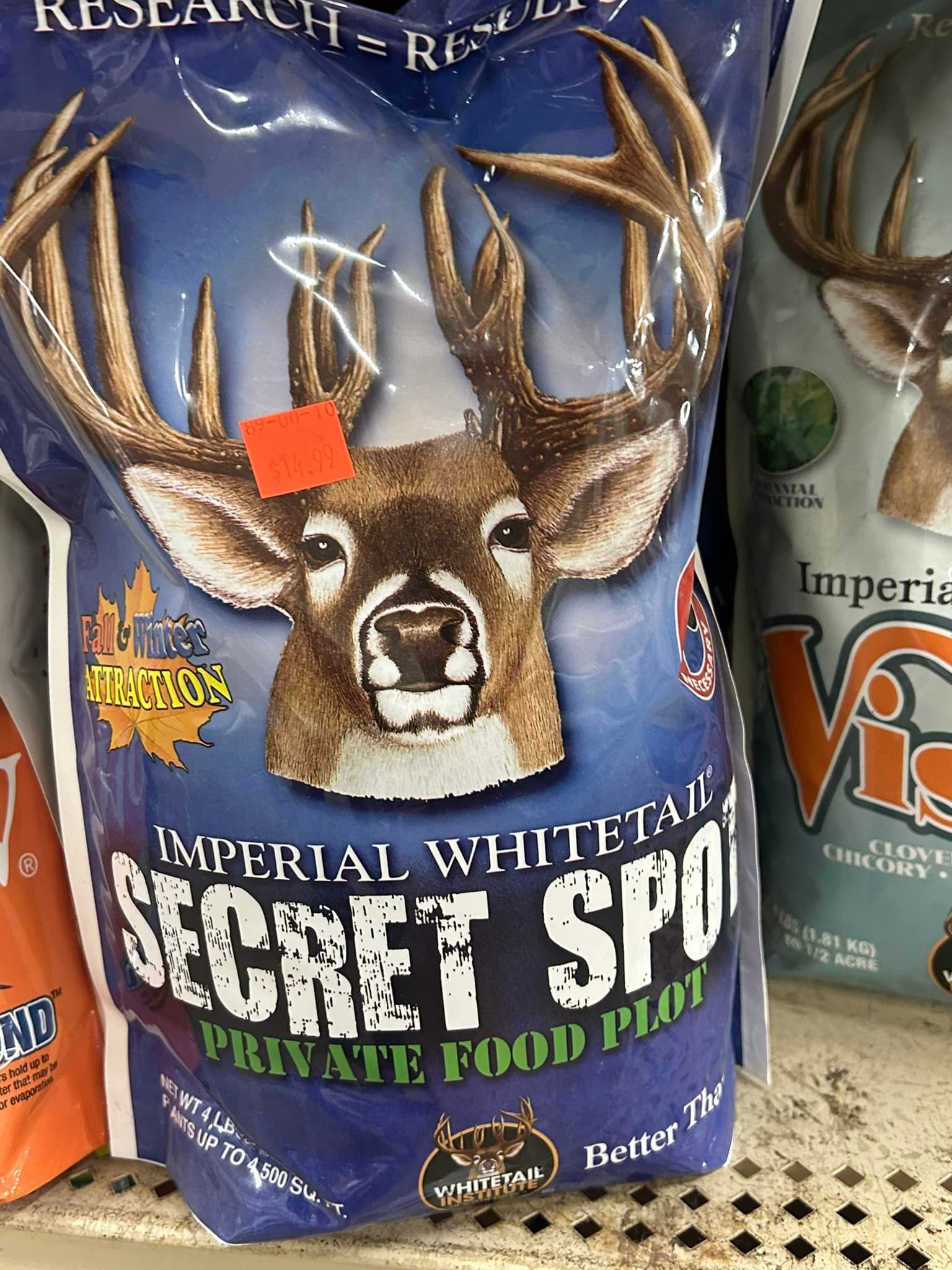 Bag of Imperial Whitetail Secret Spot deer food. Blue bag with deer graphic and product details.