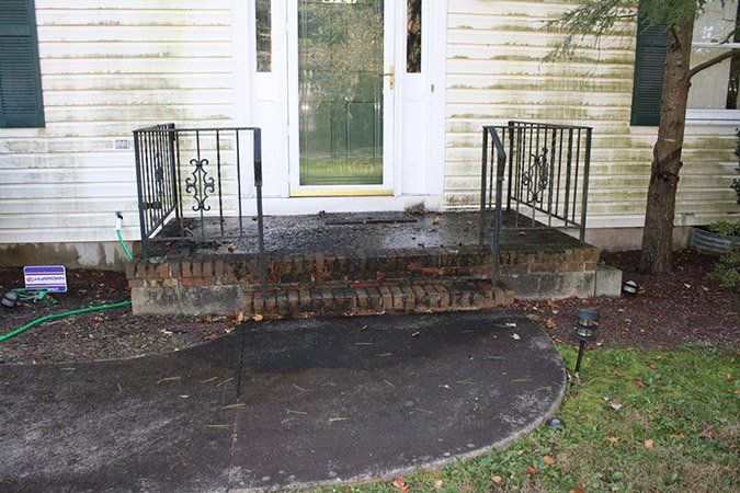 Pressure washing - Before (siding steps and walkway)  - Maintenance Services in Kendall Park, NJ